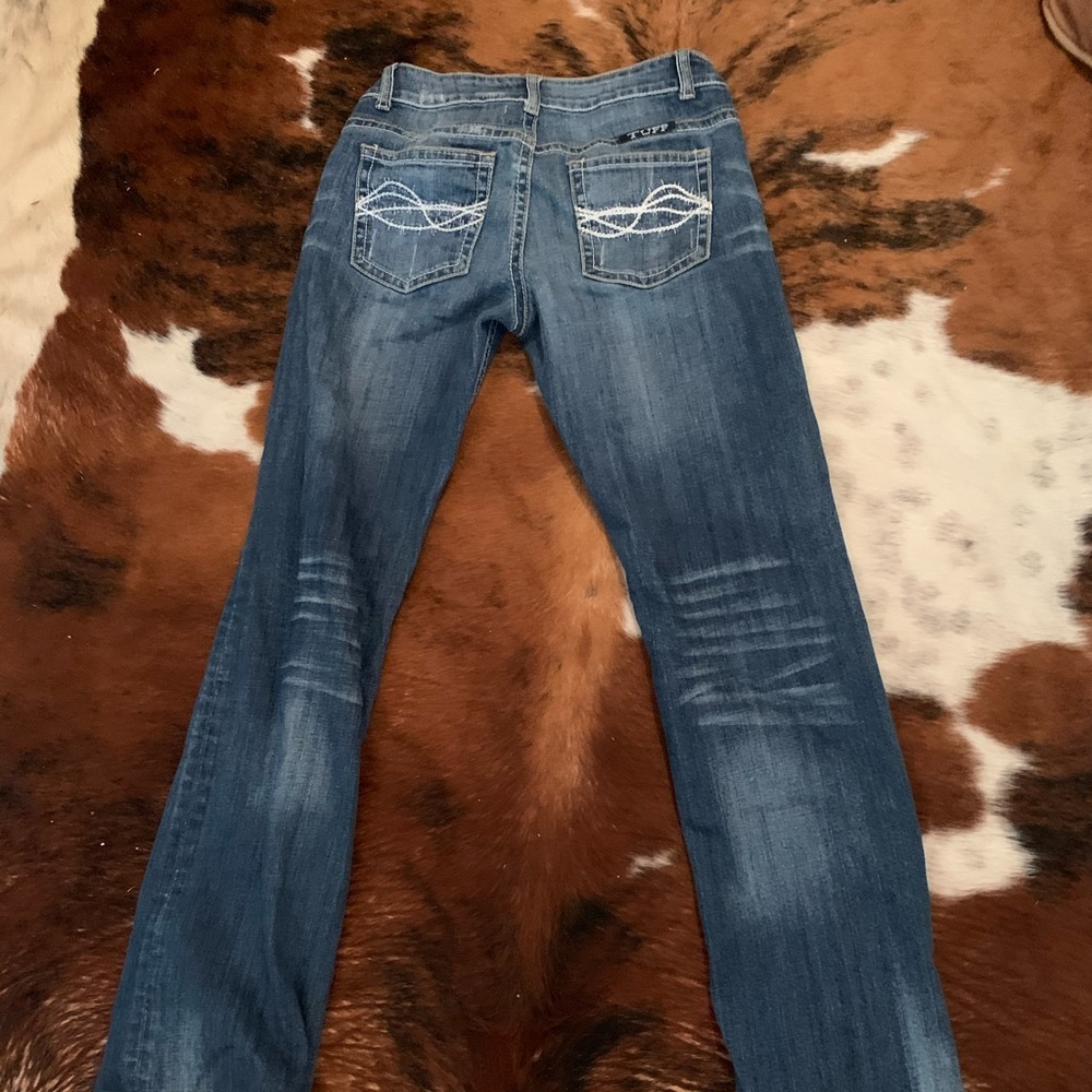 Cowgirl Tuff “Don’t fence me in” jeans.